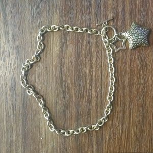 Gold tone star necklace